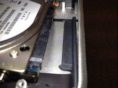 drive removed, showing the S-ATA cable unplugged.